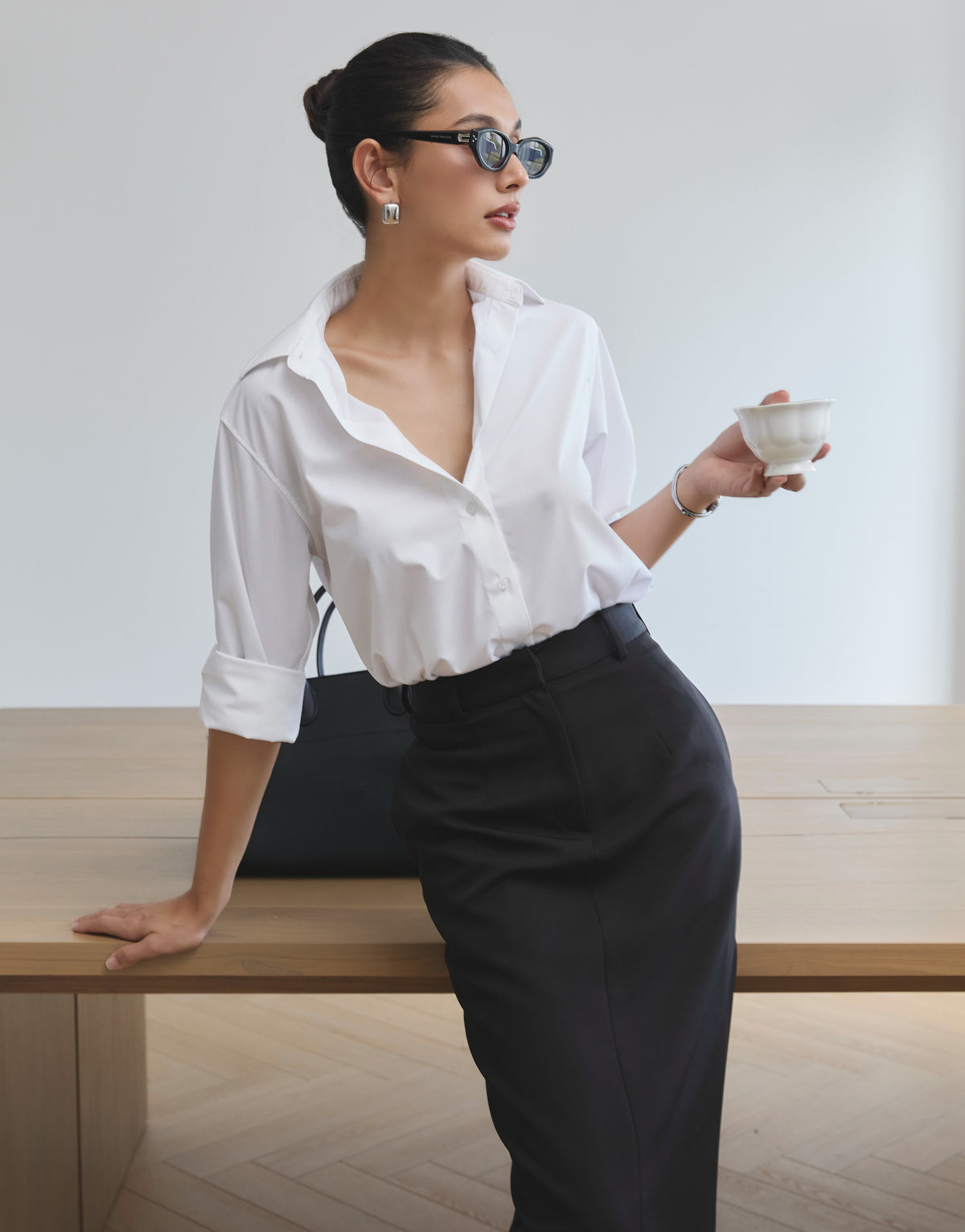 Pair our Essentials cotton shirt in white with Essentials midi pencil skirt in black for the days you need to be in c...